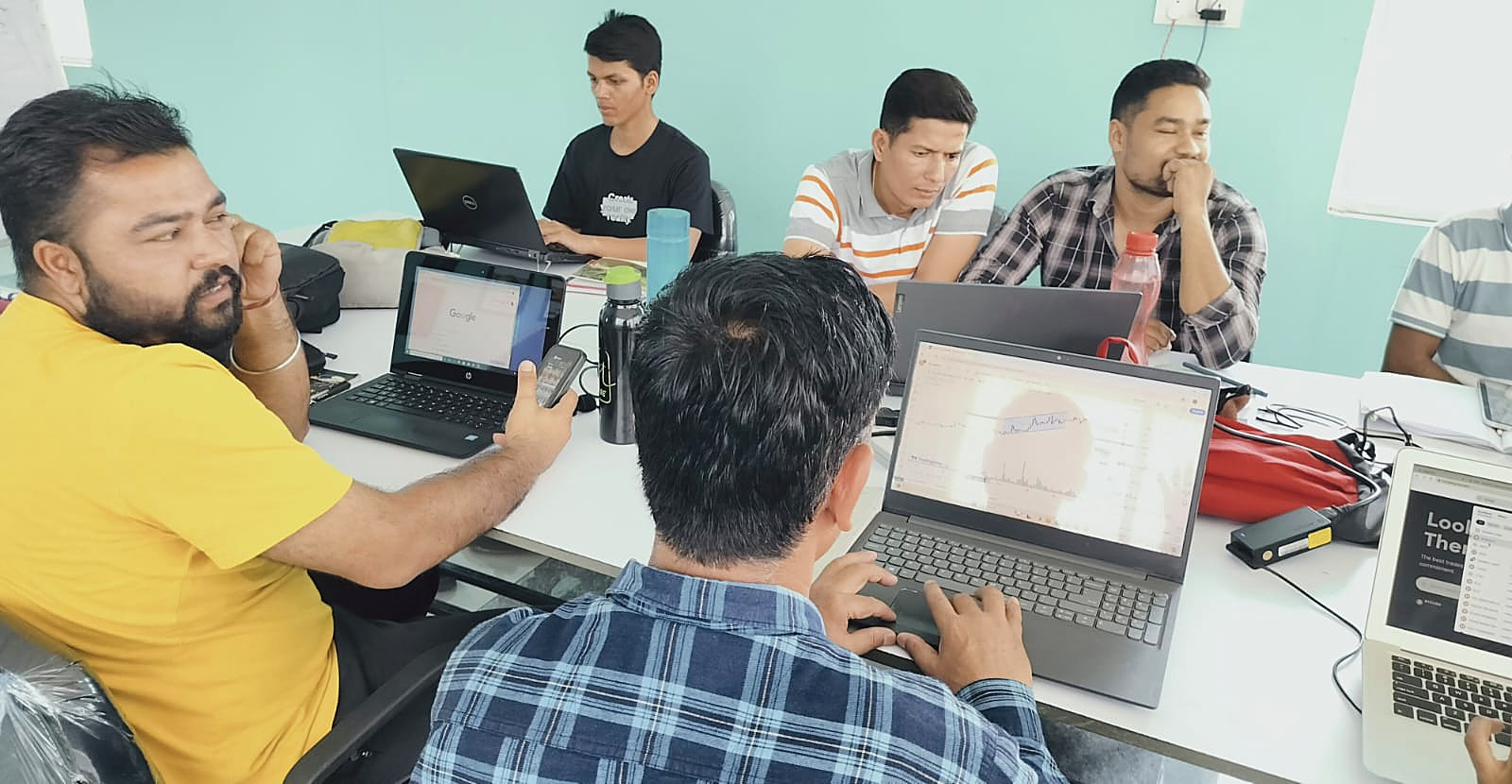 Students in a live trading classroom session