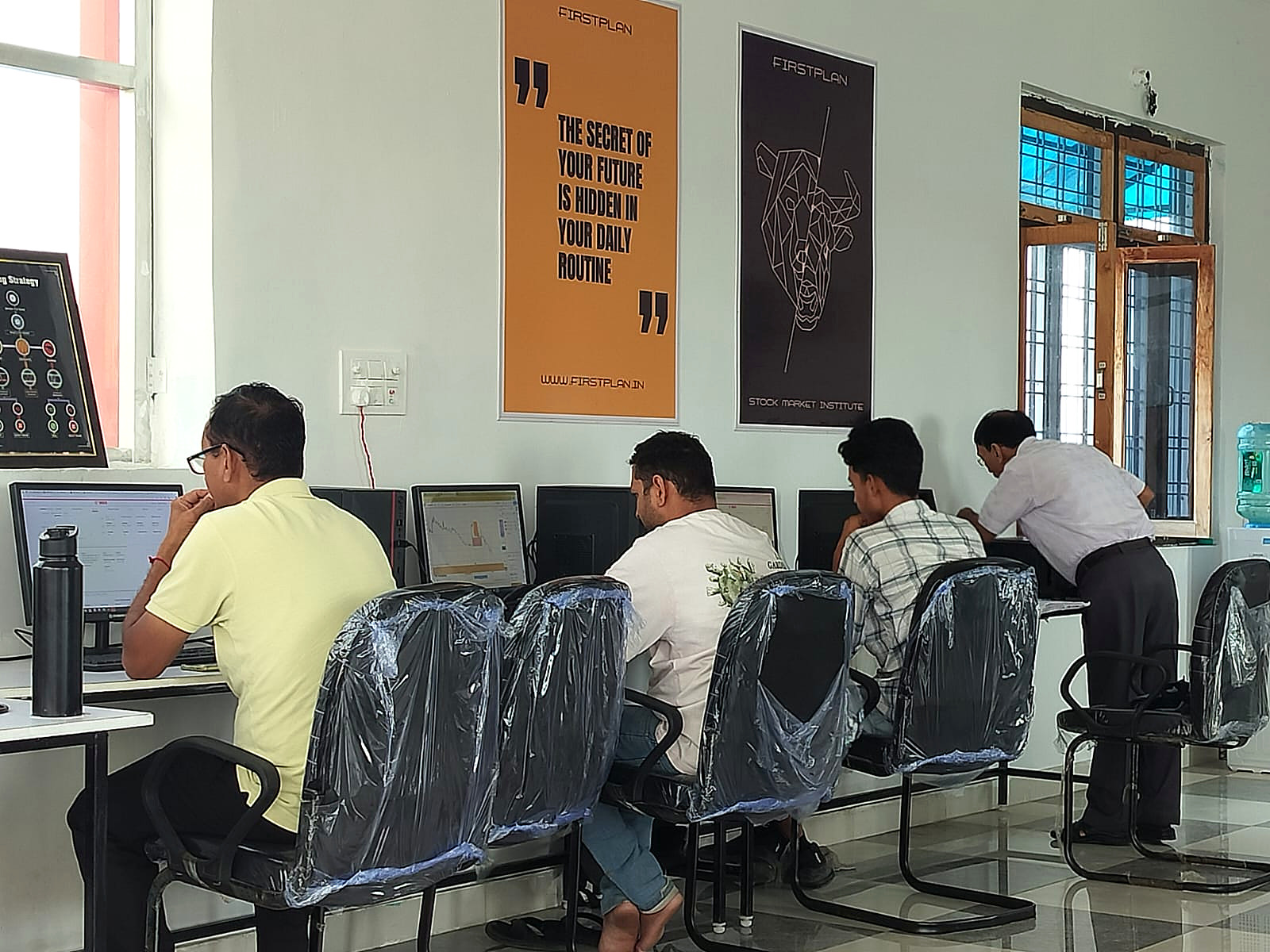 Trading desks with live market screens
